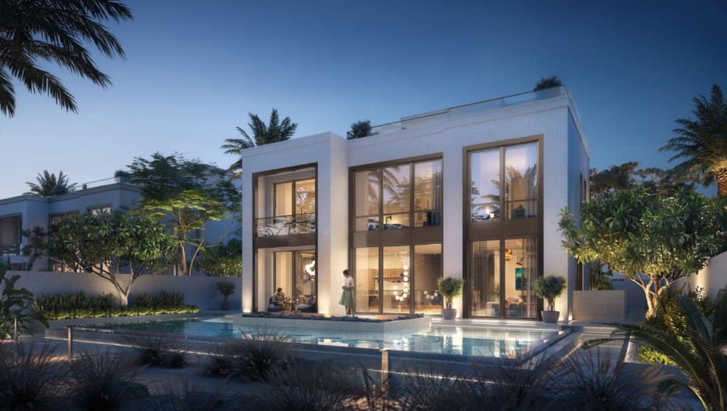 Exklusive 5-Schlafzimmer-Villa in Mirage at the Oasis von Emaar, Dubailand. Die luxuriöse Immobilie besticht durch eine moderne Architektur mit hohen Glasfronten, eleganter Beleuchtung und einem großzügigen Außenbereich. Der private Pool, umgeben von üppiger Vegetation und stilvollen Sitzbereichen, bietet eine ruhige und exklusive Atmosphäre. Perfekt für anspruchsvolle Käufer, die eine Premium-Immobilie in Dubai suchen. Jetzt auf nikvandamme.ae entdecken.






