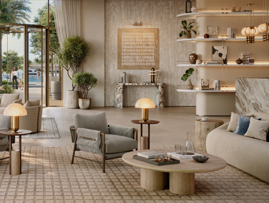 Elegante Lobby der Baystar by Vida Residenzen in Dubai mit großzügiger Glasfront, hochwertigen Designmöbeln in Naturtönen, stilvoller Dekoration und entspannter Lounge-Atmosphäre. Große Leuchtringe an der Decke und Palmen vor dem Eingang unterstreichen den exklusiven Charakter.